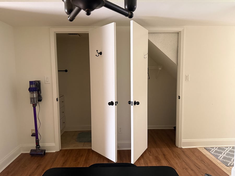 Bathroom door on left and hall closet on right. Dining area is across from these doors.