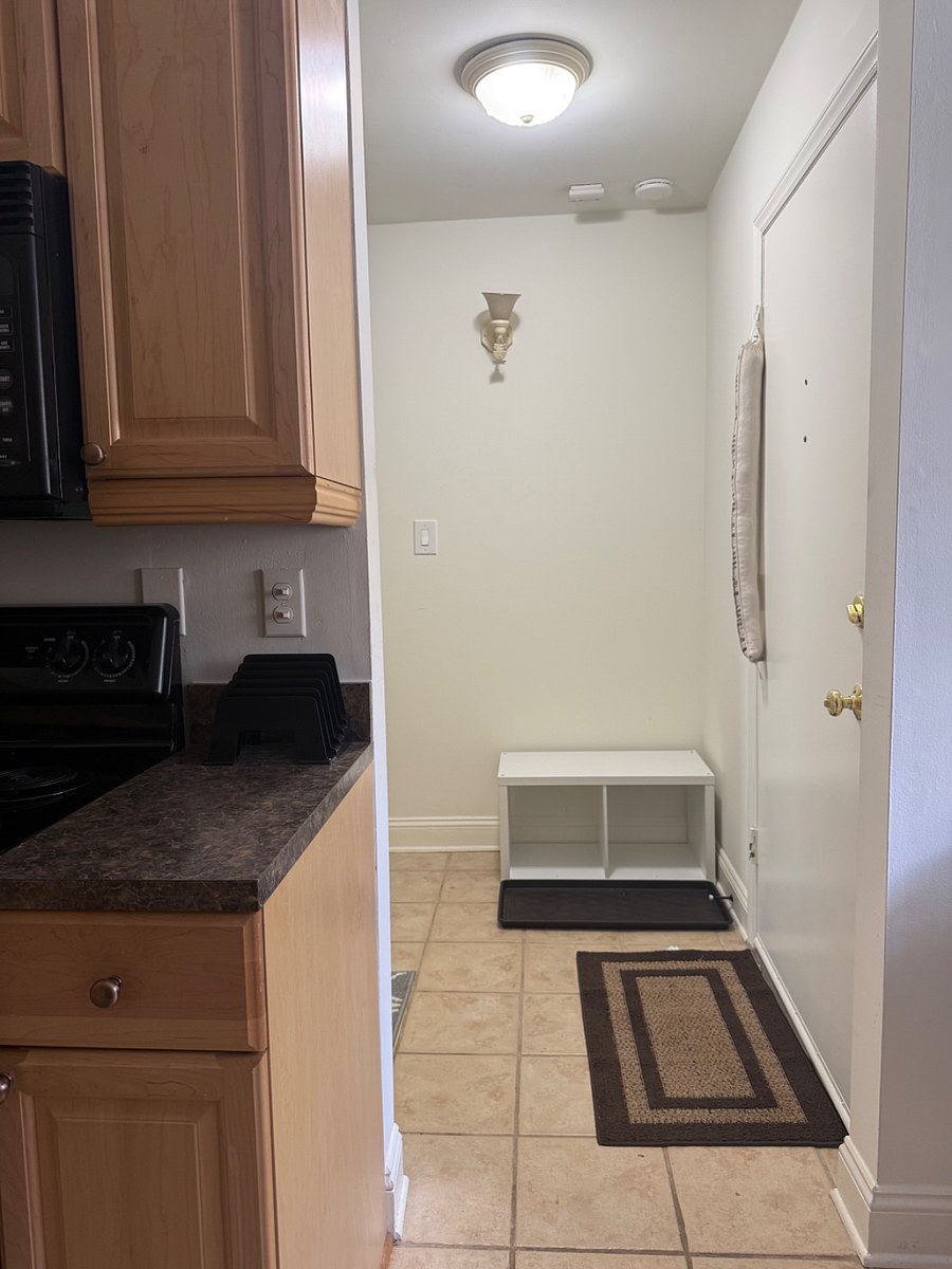 View to right of entrance with shoe are and access to stairs to bedrooms, full bath, and laundry area.Ba