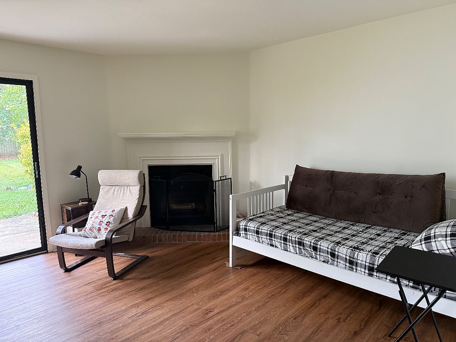 Living area with fireplace and day bed.