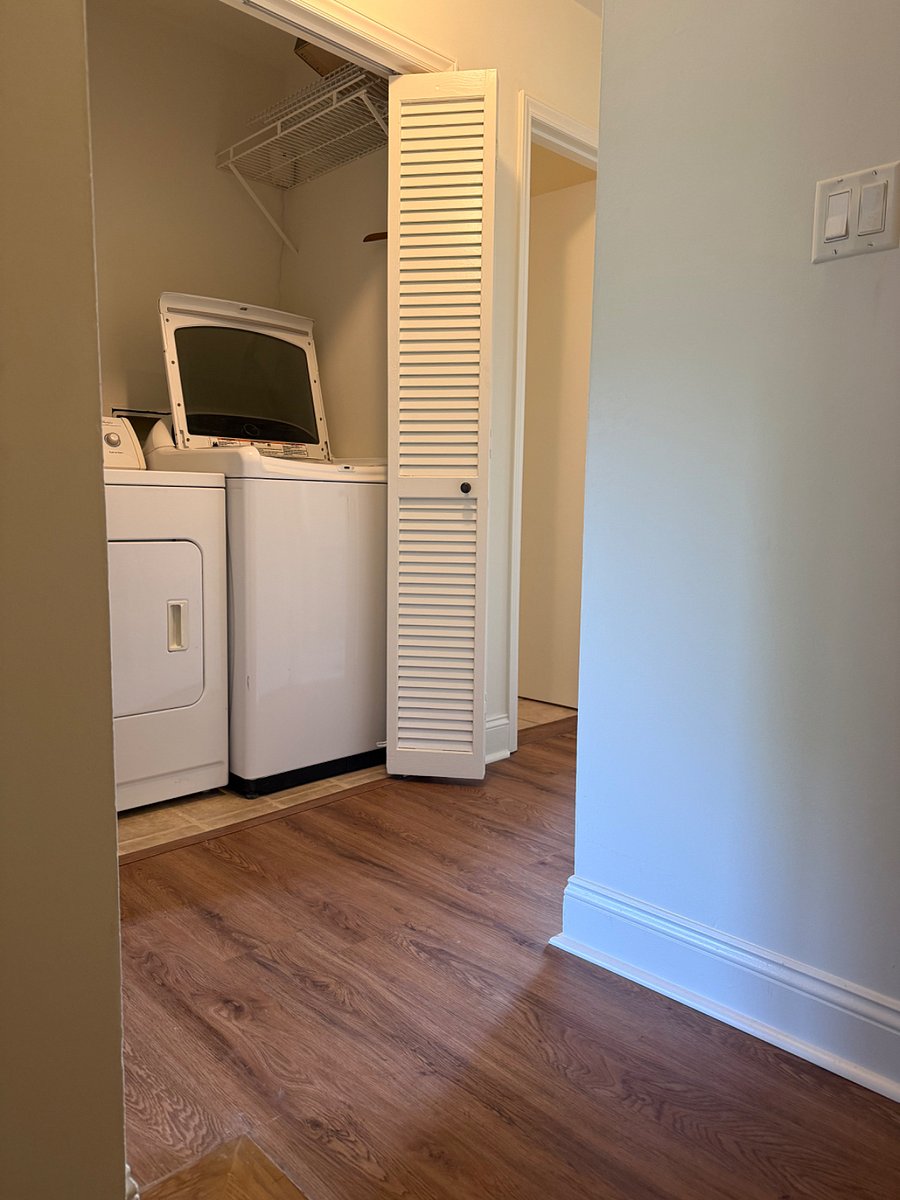 Upstairs landing with washer and dryer.