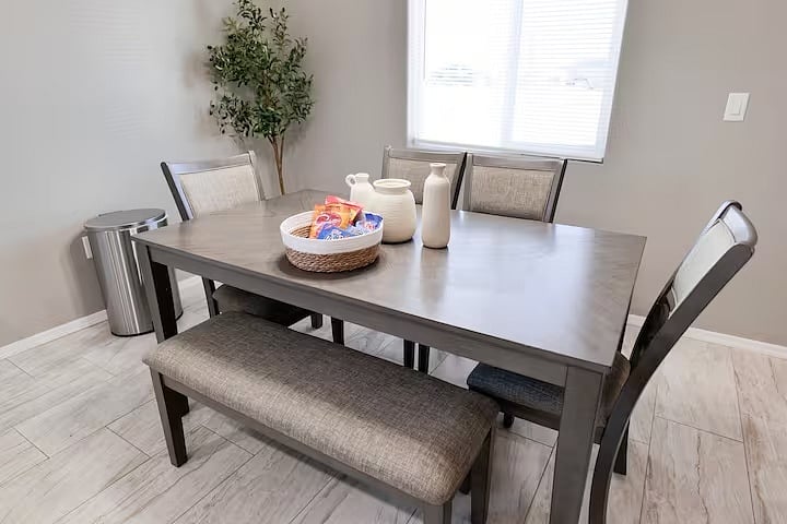 Enjoy your morning coffee or a quick meal in this cozy dining nook, thoughtfully set up for comfort and convenience.