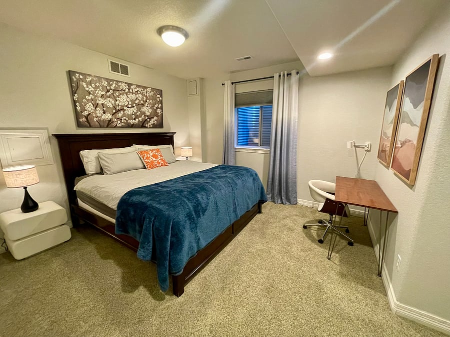 King bedroom with desk.