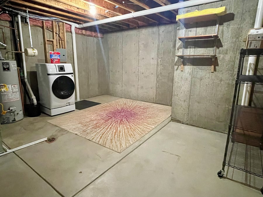 Large bonus storage room with all in one washer/dryer unit.