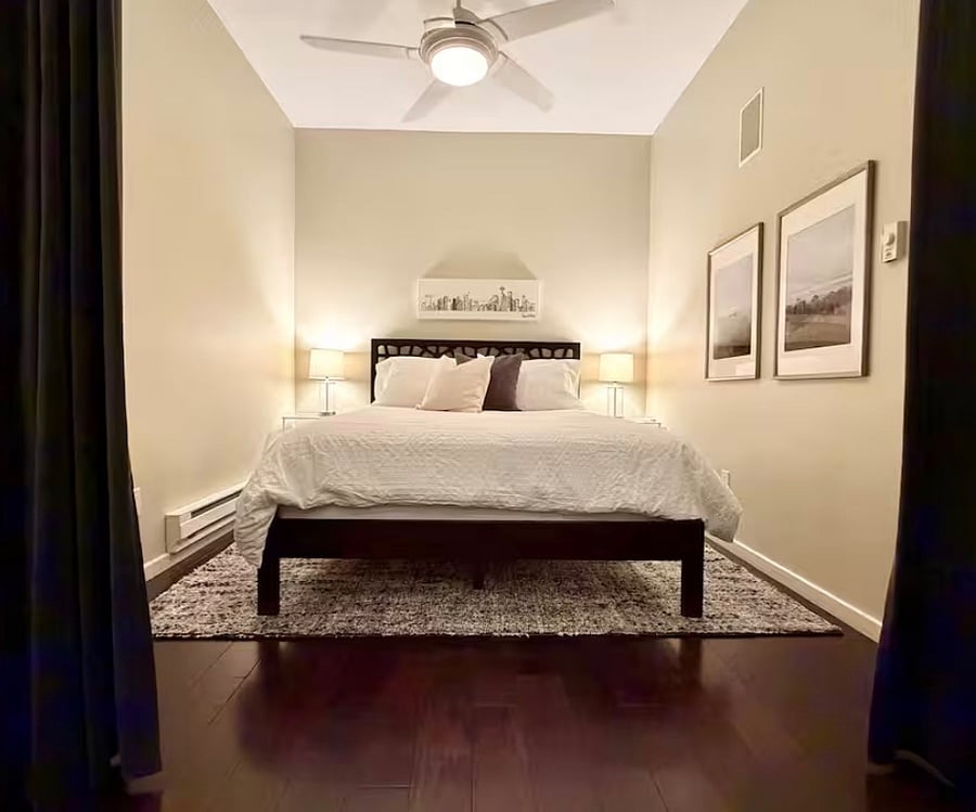 The 2nd Bedroom is a semi-private space with floor to ceiling curtains to help block light and sound. This space can also be furnished as an office if needed.