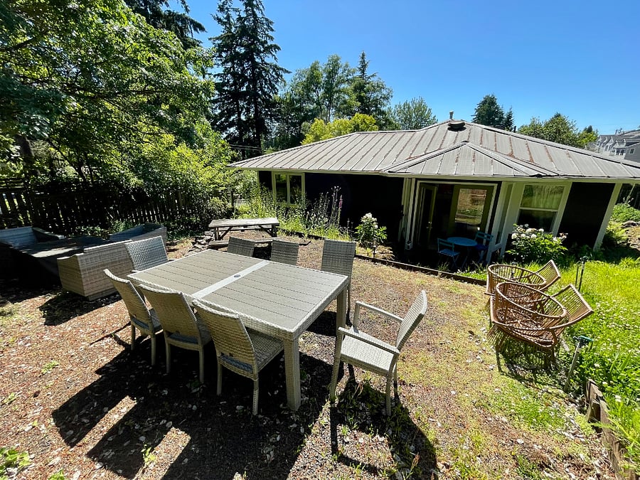 Side yard with fire pit, dining, and sunset views