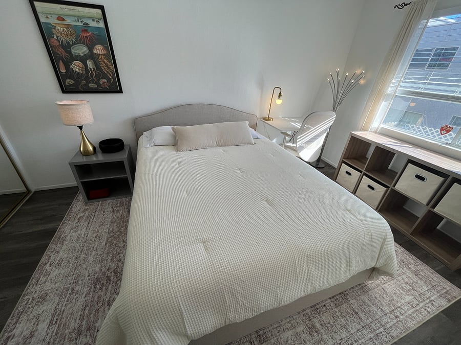 Queen bed with bedding