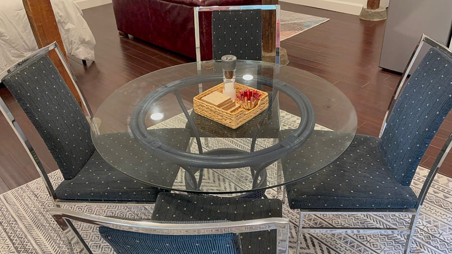 Glass dining table seats 4 comfortably