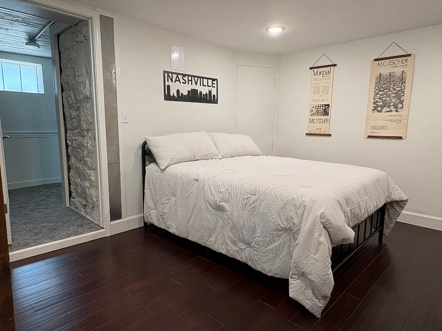 Bed located beside entrance to walk-in closet