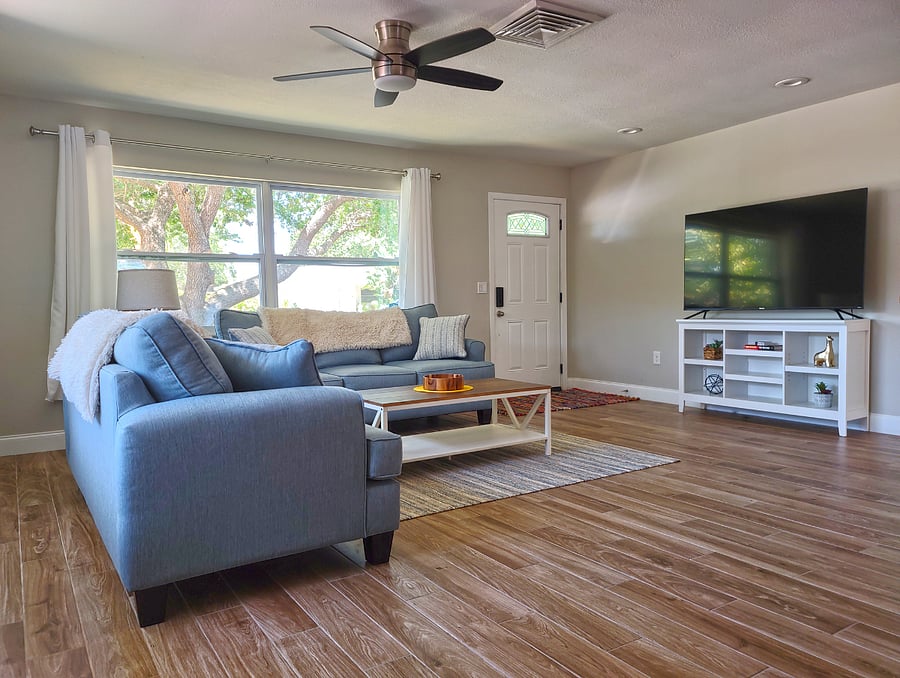 Spacious Front Living Room with 65" Smart TV
