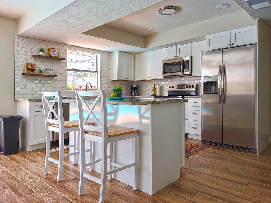 Newly Renovated Kitchen with Granite Countertops and Stainless Steel Appliances. Stocked with Pots, Pans, Dishes & Utensils for Cooking.