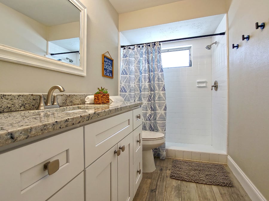 Master Bathroom with Large Shower, Granite Vanity & Plenty of Hooks for Your Beach Gear