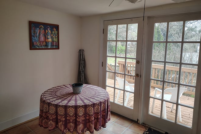 Sun room available as additional workspace; view onto back porch