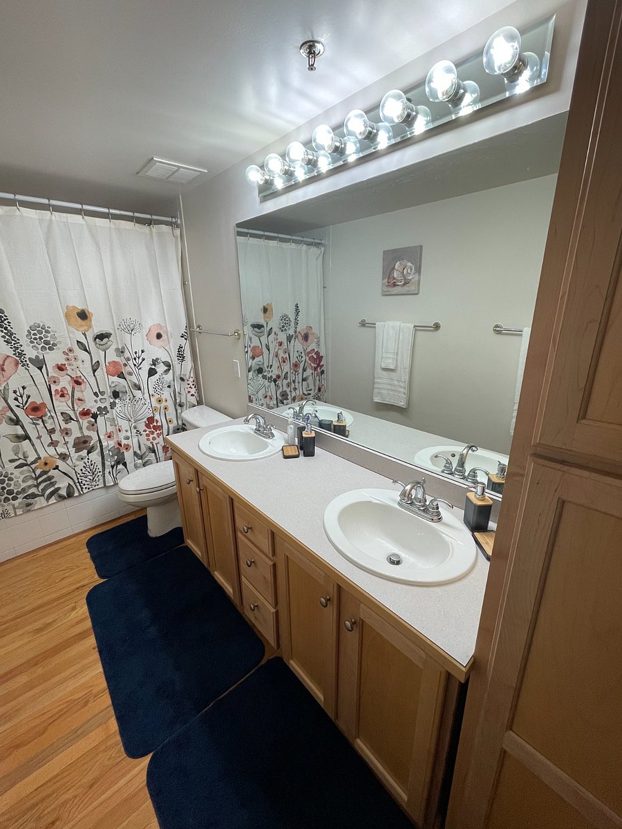 Double vanity bathroom with oversized bathtub