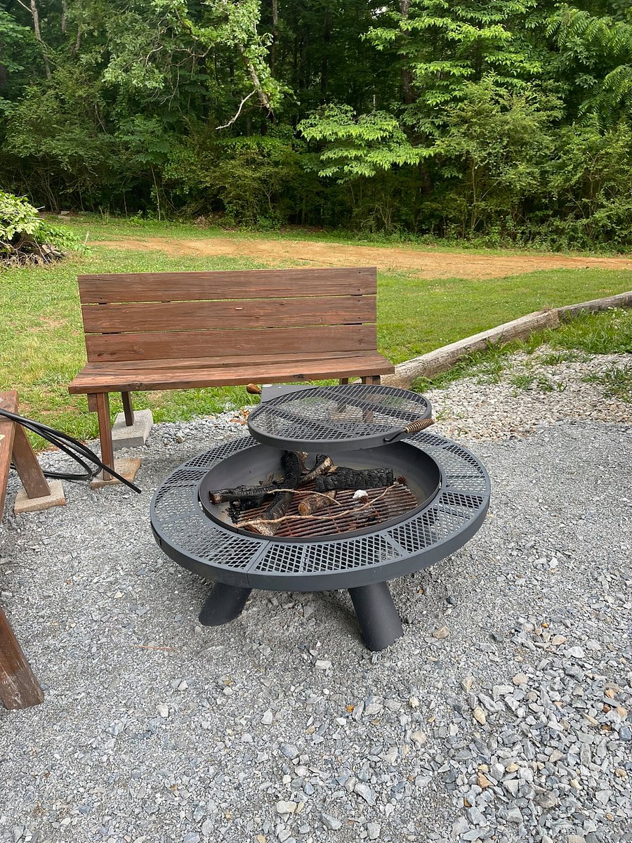 Fire pit out back with benches to sit and fellowship. 