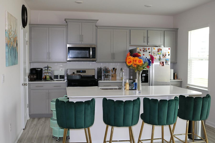 Kitchen with bar chairs