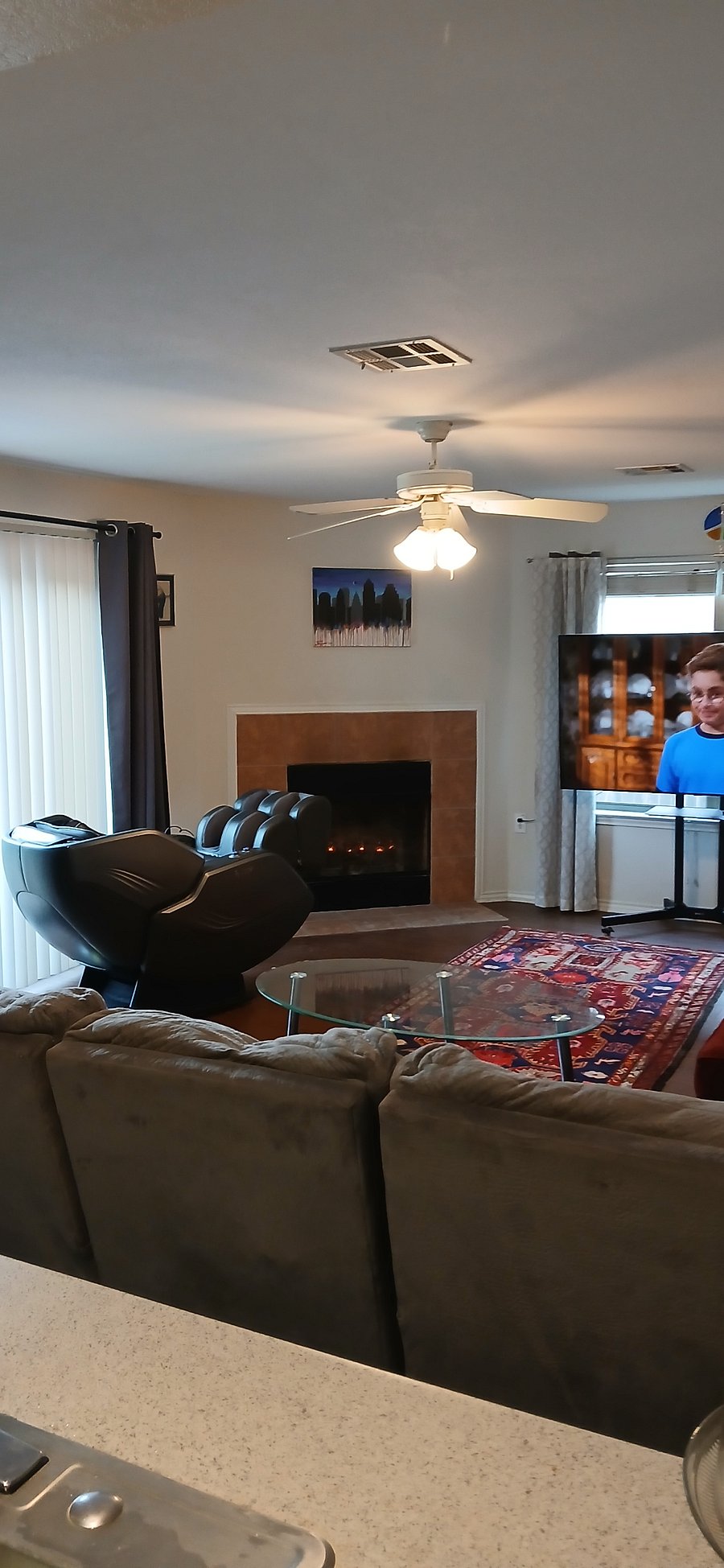 Living room w/ Comfier Massage Chair 360, big screen tv, & reclining couches