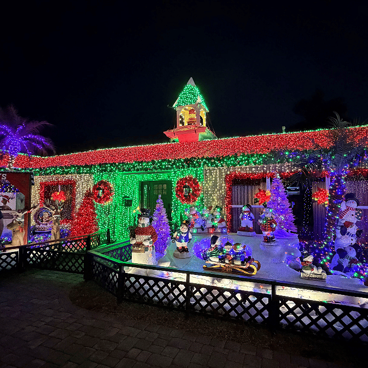 this neighborhood private Christmas light display attracts visitors all season long and is just two blocks away