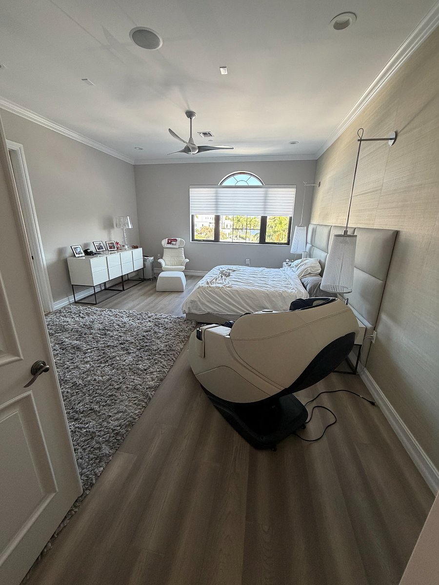 Third floor spacious master bedroom with large window overlooking private pool, boat slip with amazing skyline views; massage chair; large walk-in closet