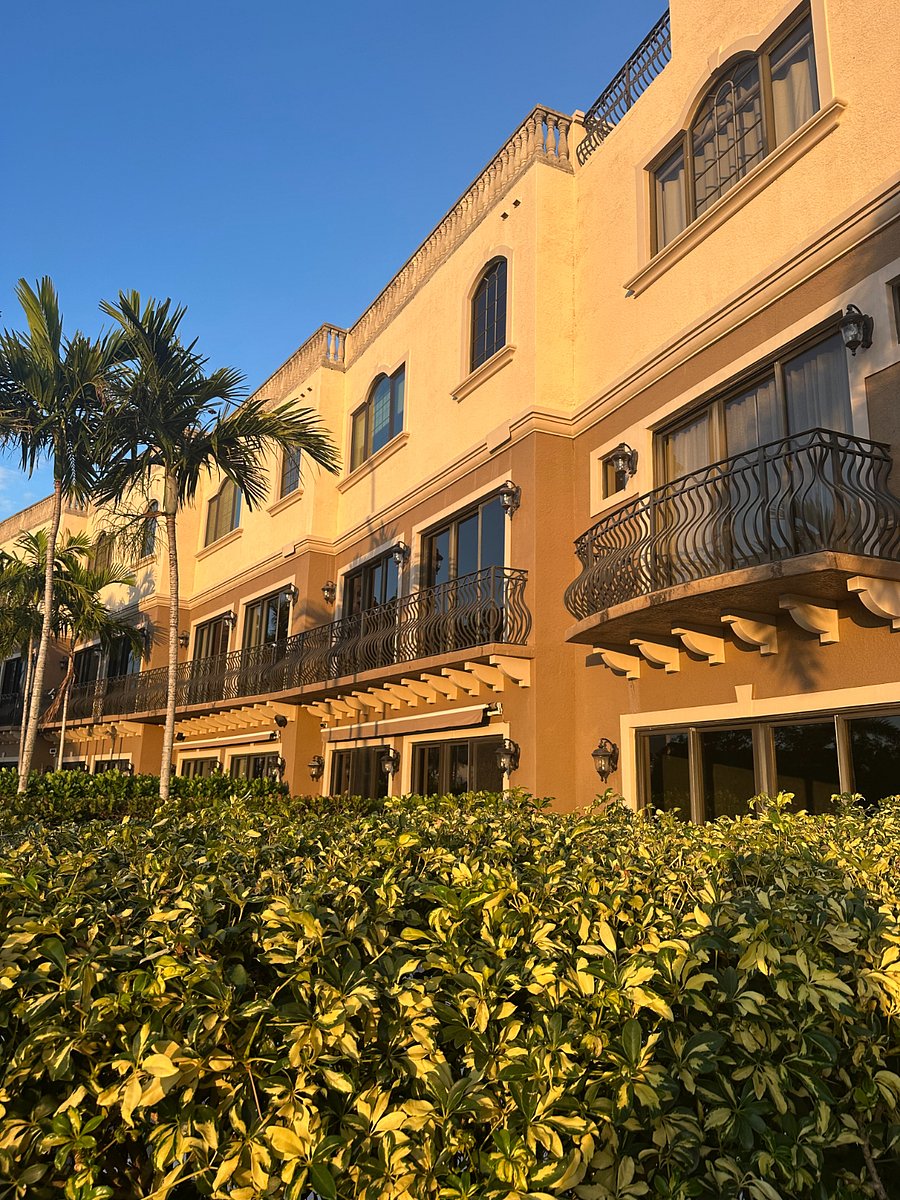 Long second level balcony and master bedroom and bathroom windows overlook my pool and boat slip; landscaping gives privacy to the pool deck area