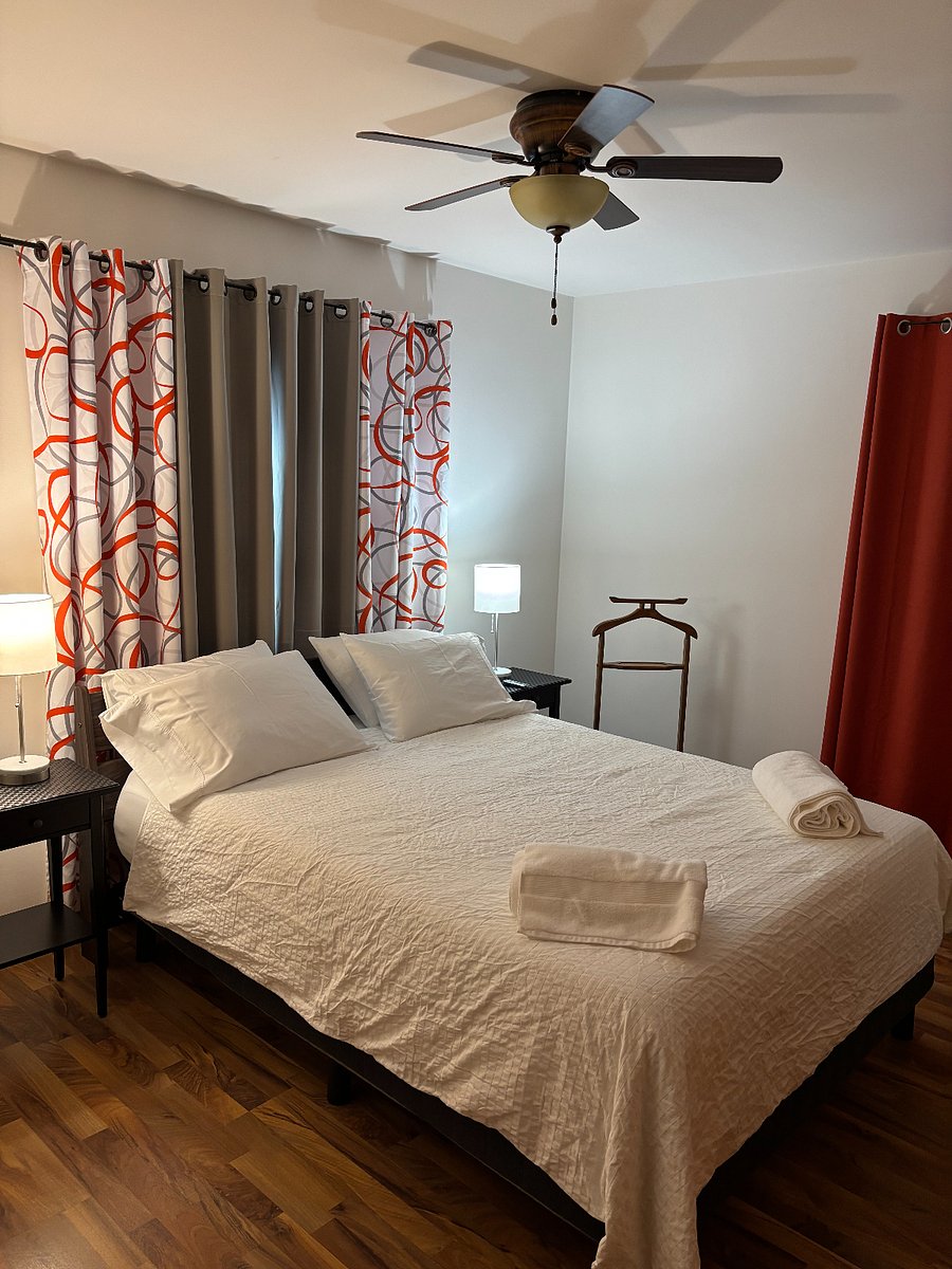 Back bedroom. Queen bed. Firm mattress. Blackout curtains. Closet.