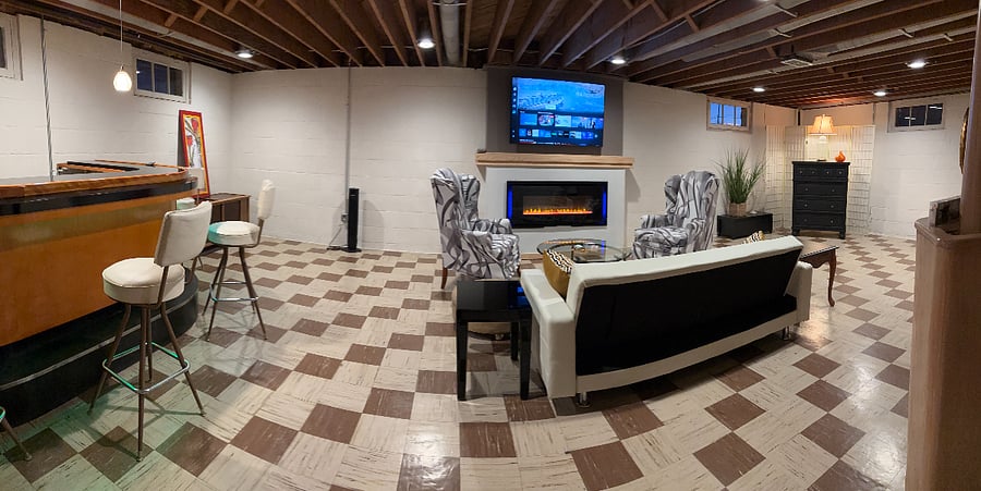 Basement next to the laundry room. Wet bar, linear electric fireplace, smart TV. Futon for an extra sleeping arrangement.