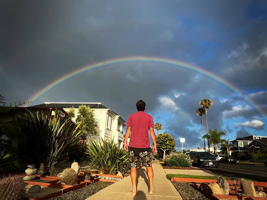 Sunrise rainbow in front of the house