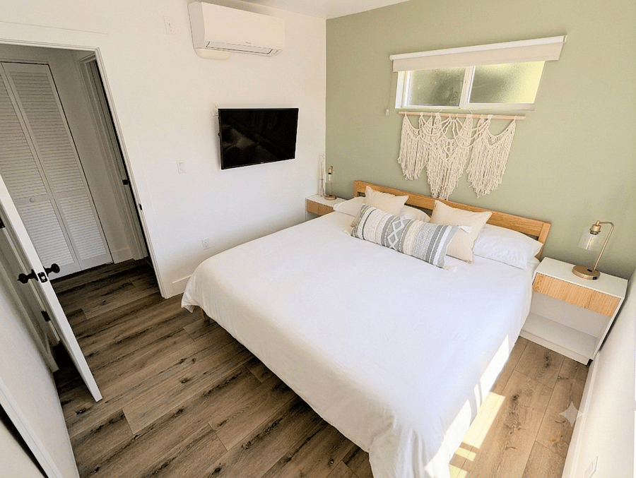 Bedroom with king size bed, TV and closet. AC and darkening blinds.