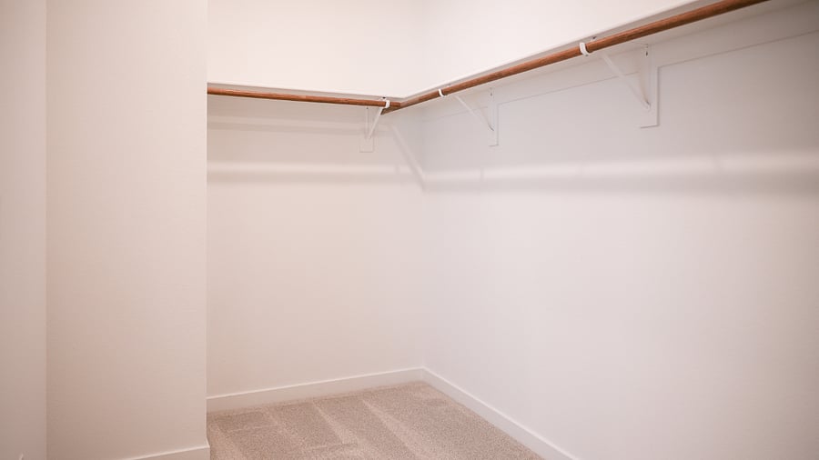 Large walk-in closet in primary suite 