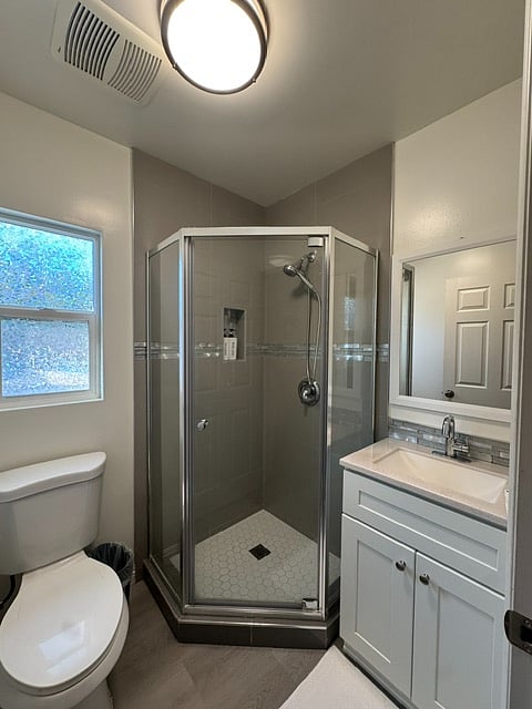 Private en-suite bath for Bedroom 2 with stand-up shower