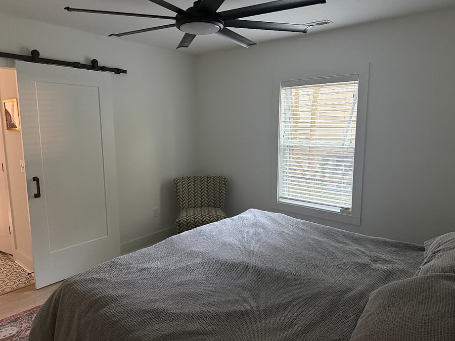 Primary bedroom featuring King size bed and walk-in closet