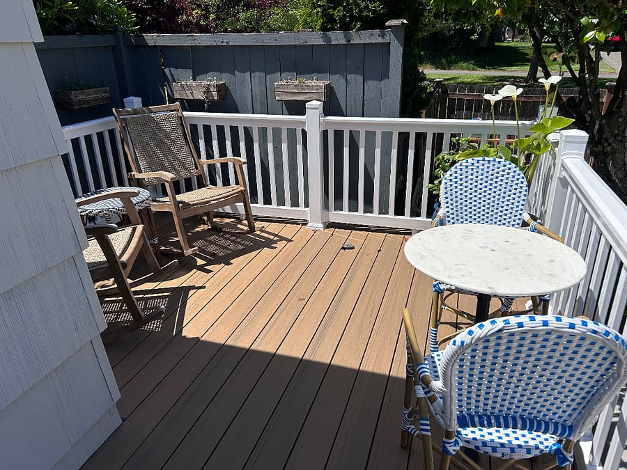 Shared deck with rocking chairs for relaxing.