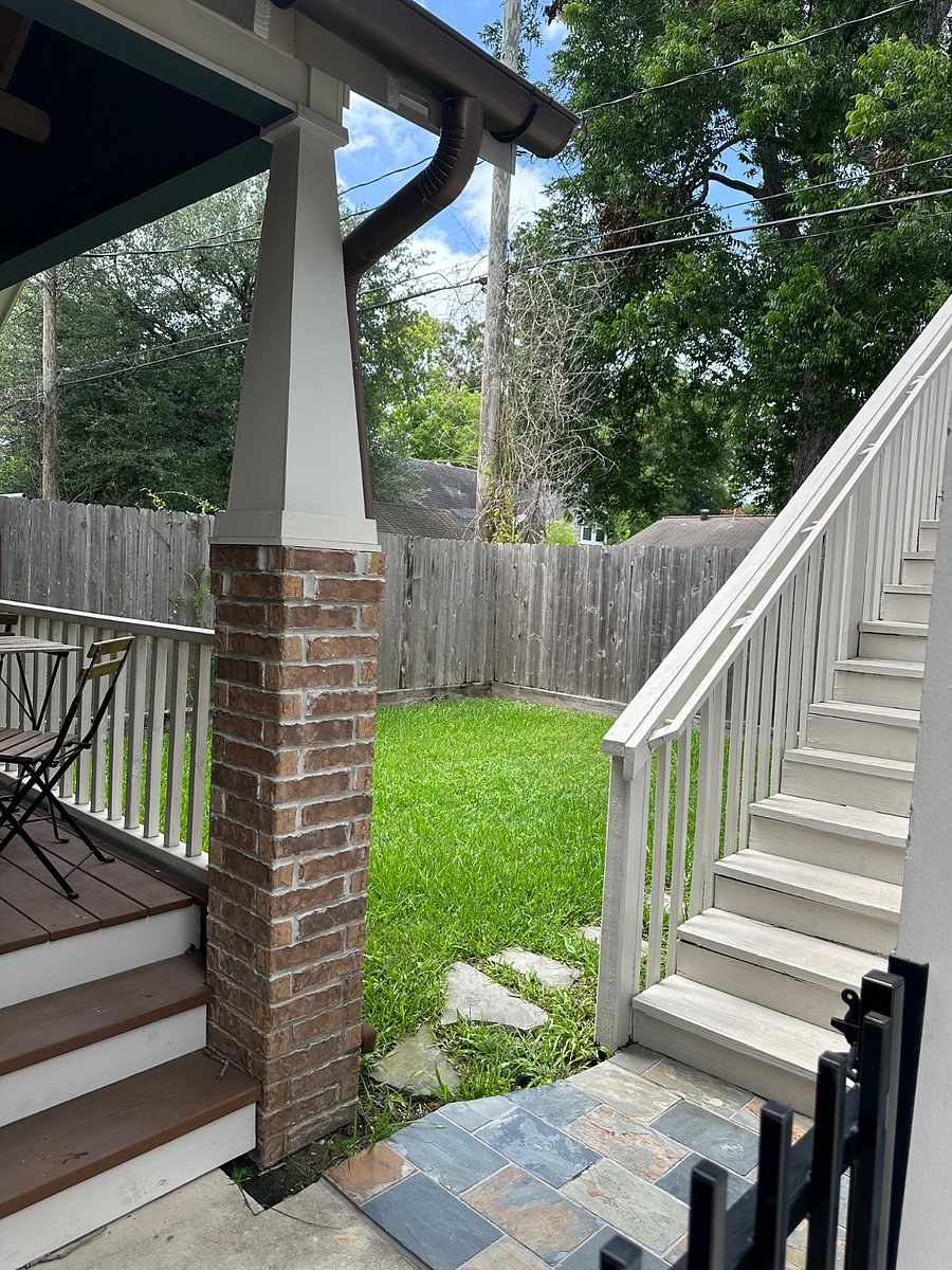 The garage apartment is separated from the house by the backyard and the property is gated front and back.