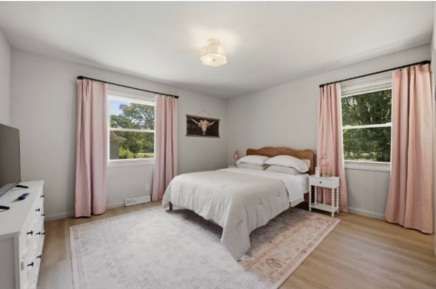 Master Bedroom with Queen bed, side tables, large dresser and 40TV