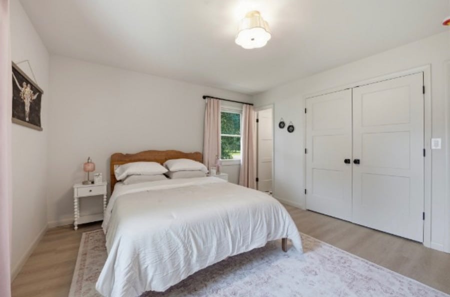 Master Bedroom with Queen bed, side tables, large dresser and 40TV