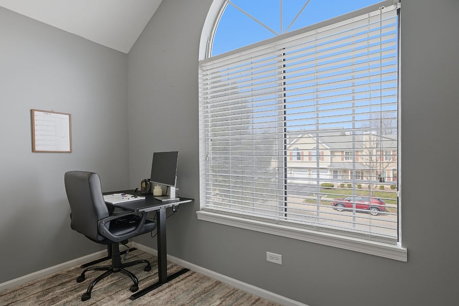 Work from home adjustable desk and monitor in the Master Bedroom.
