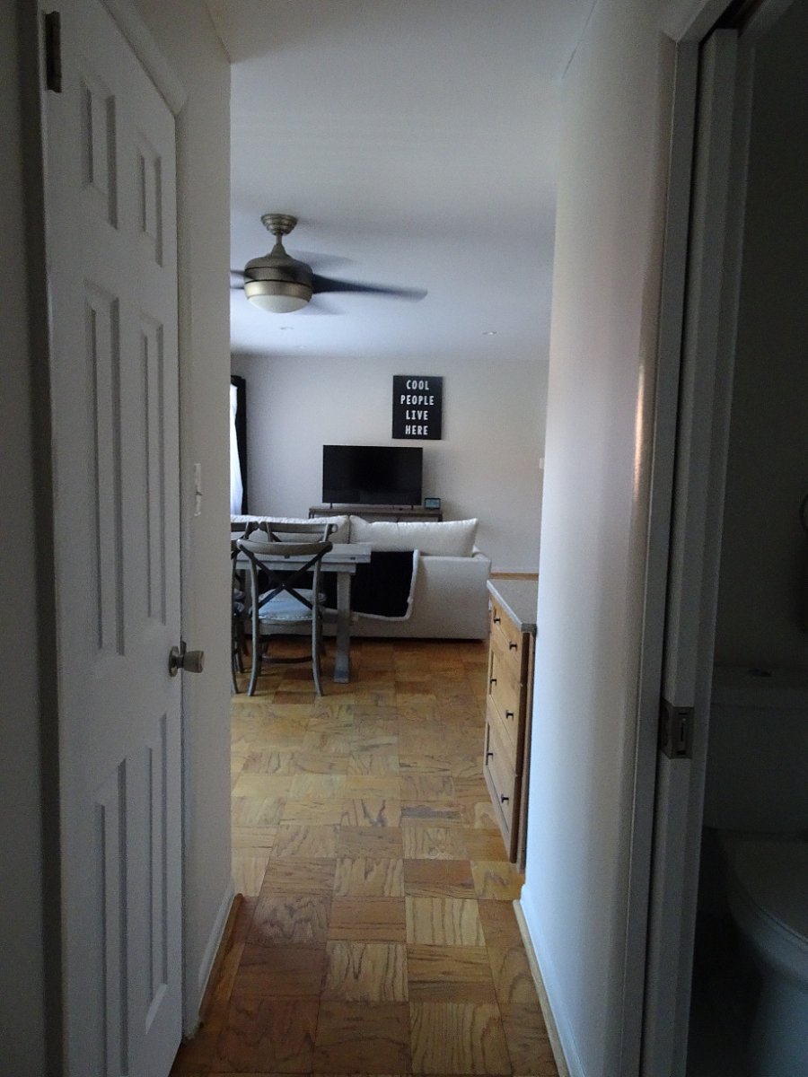 hallway, walk-in closet door on left