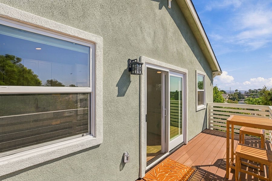 Indoor-outdoor living between the main room and the private deck