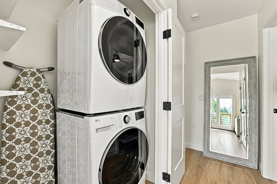 Brand new large capacity washer & dryer, iron, ironing board, cordless vacuum cleaner.