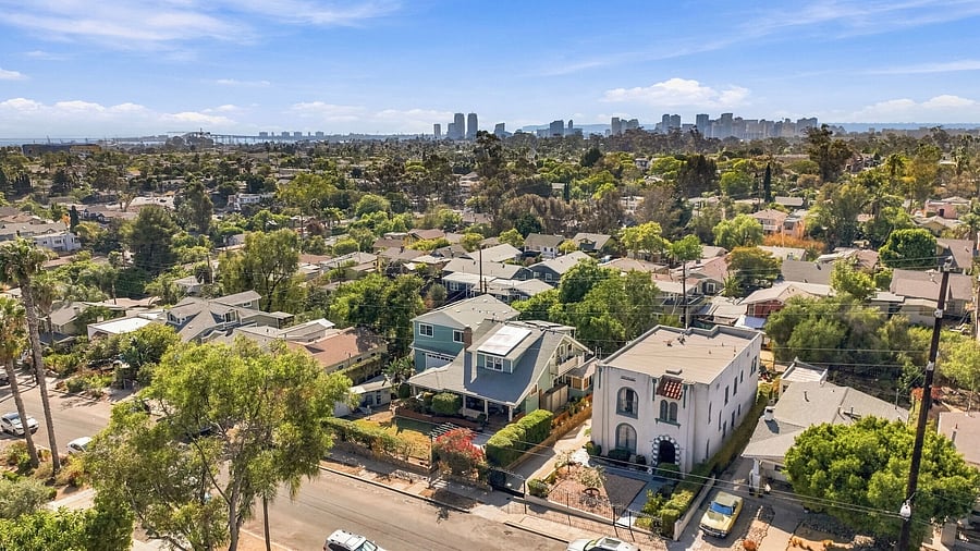 Quiet residential neighborhood bisected by canyons full of trees and wildlife. See downtown in the distance, just 10 minutes drive away. Note the plentiful street parking at the time this photos was taken.