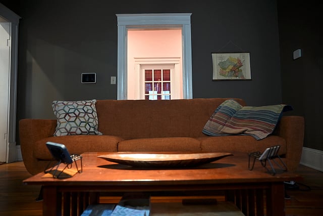 Den with new, modern, long couch. 