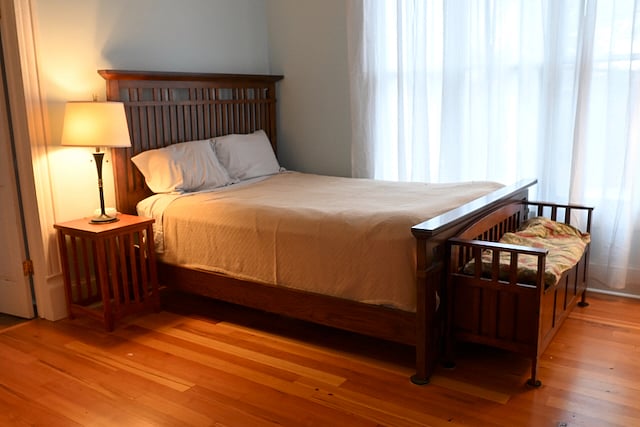 Queen Bedroom with queen sized bed, dresser, and two closets. 