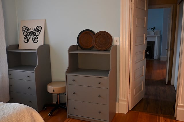 View of Full Bedroom two dressers and hallway to Queen Bedroom. Adjoining bathroom and large closet are in this hallway.  
