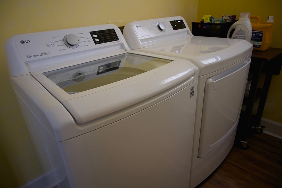 Laundry Room with washer, dryer, iron and ironing board.