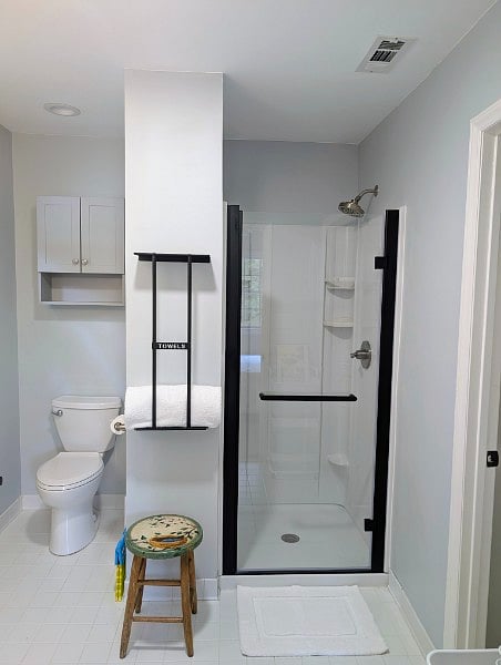 The upstairs bathroom has a smaller but brand-new shower.