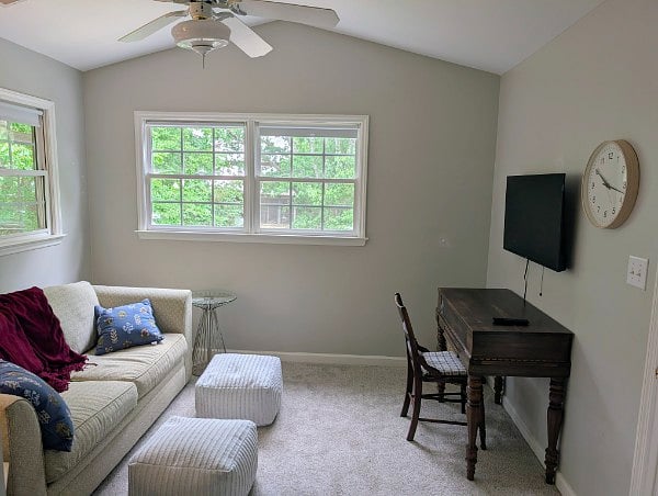 The office has a desk and smart TV for work or play.