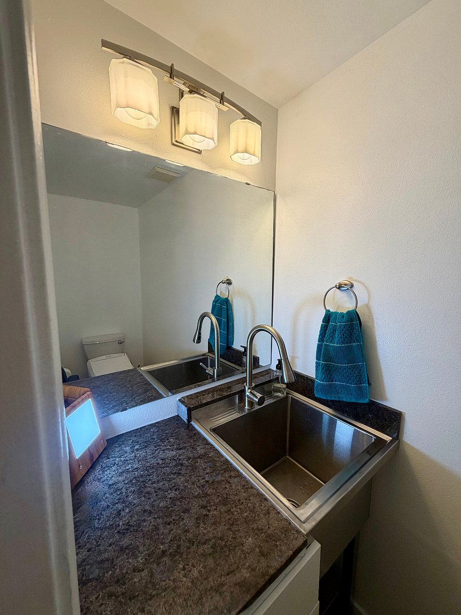 There is a new utility sink in The Garden Grotto bathroom.