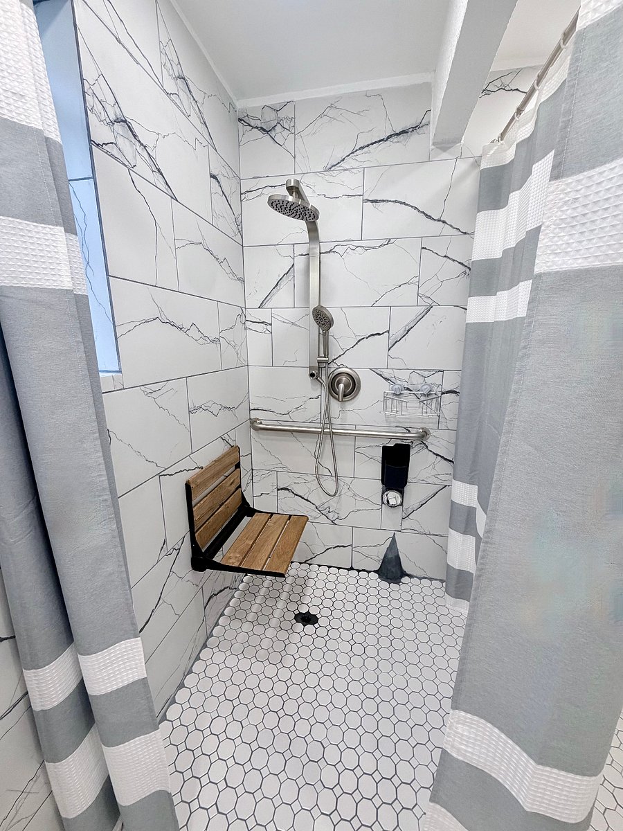 Roll-in shower with fold-down seat