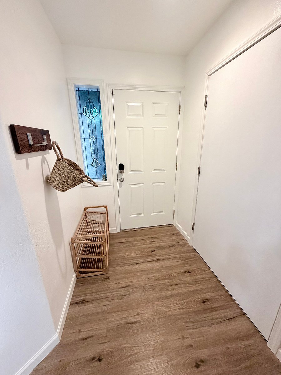 Front entry door adjacent to entry door from garage