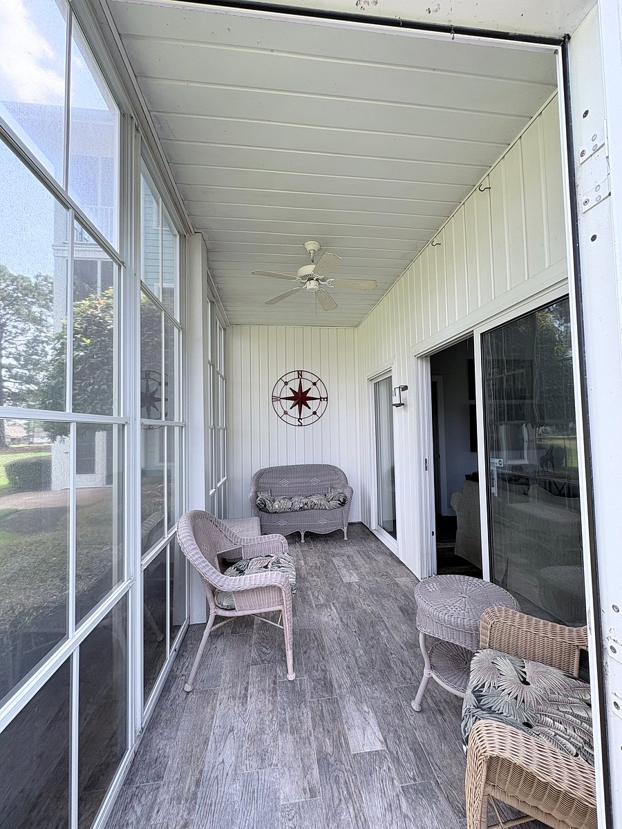 All weather screened in porch with easy breeze windows off of Main Villa. Looking over 10th hole of the Byrd golf course
