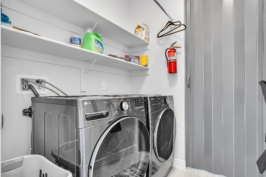 Private laundry area with full-size washer and dryer available for guest use during your stay.